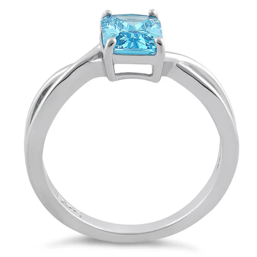 ANILLO EN PLATA DISEÑO TORCIDO CON CIRCON COLOR TOPACIO AZUL
