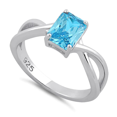 ANILLO EN PLATA DISEÑO TORCIDO CON CIRCON COLOR TOPACIO AZUL