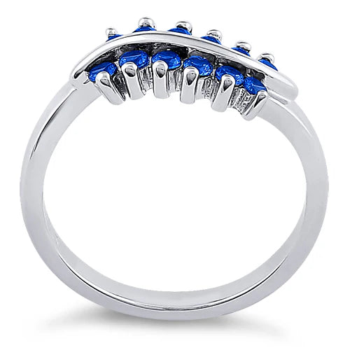 ANILLO EN PLATA CON ZAFIROS AZULES EN CURVA